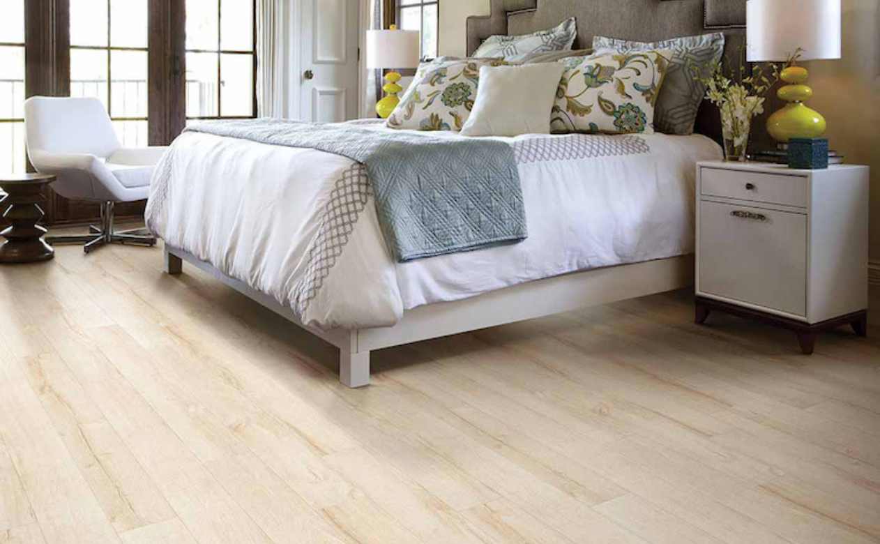 white oak look laminate in bedroom with yellow accents