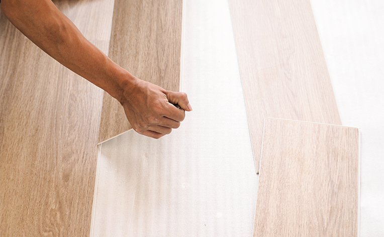click lock wood-look flooring being installed