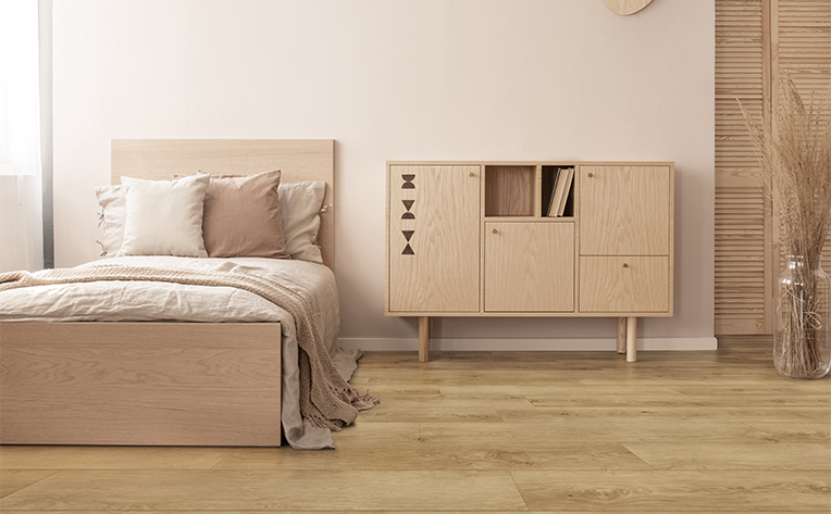 luxury vinyl in bedroom with dresser